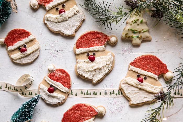 horizontal photo of Chai Spiced Santa Cookies with White Chocolate Frosting