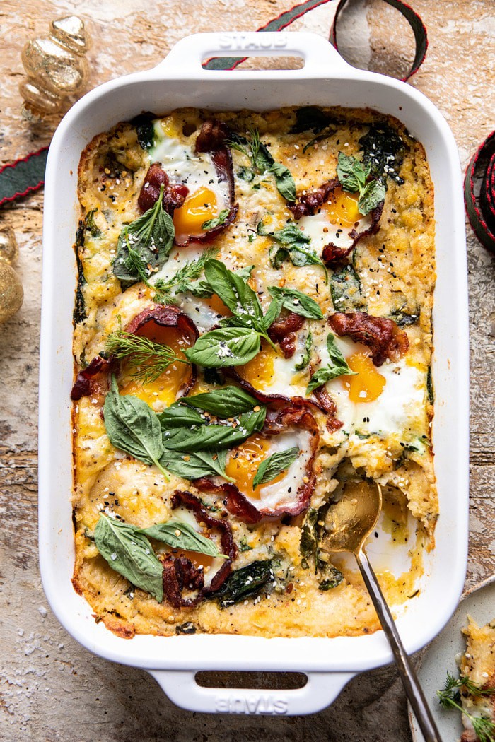 overhead photo of Everything Cheesy Potato and Egg Breakfast Casserole with spoon in dish