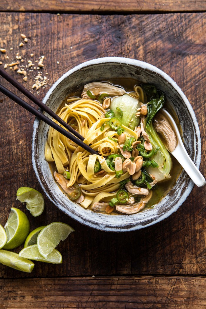 overhead photo of Ginger Peanut Chicken Noodle Soup with chopsticks in bowl 