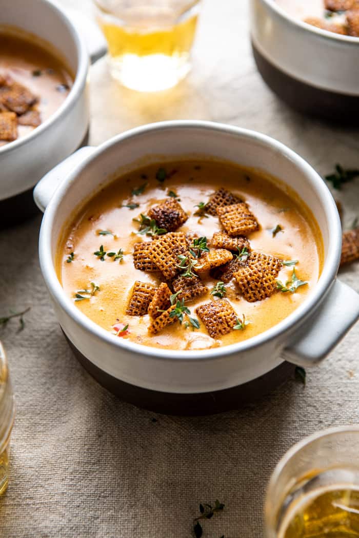 side angled photo of Beer Cheese Soup with Chili Spiced Chex 