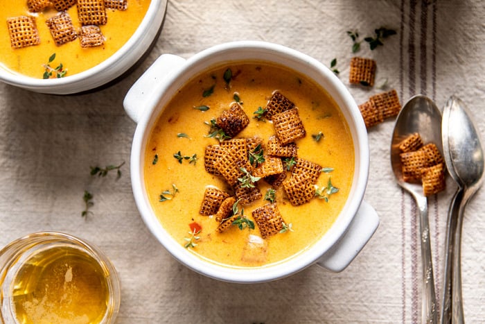 horizontal photo of Beer Cheese Soup with Chili Spiced Chex 