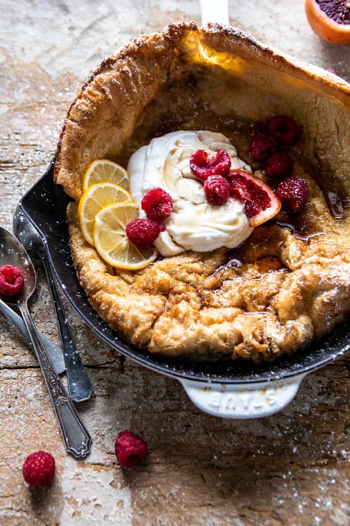 side angle photo of Whole Wheat Dutch Baby in skillet with Meyer Lemon Whipped Ricotta