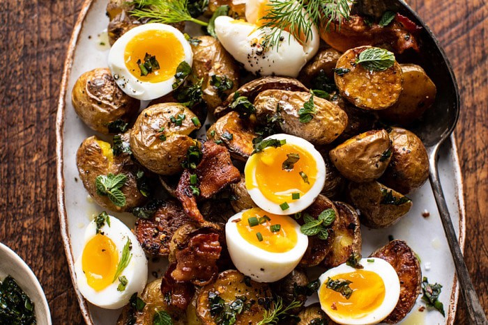 horizontal photo of Crispy Breakfast Potatoes with Chili Garlic Oil and Herbs