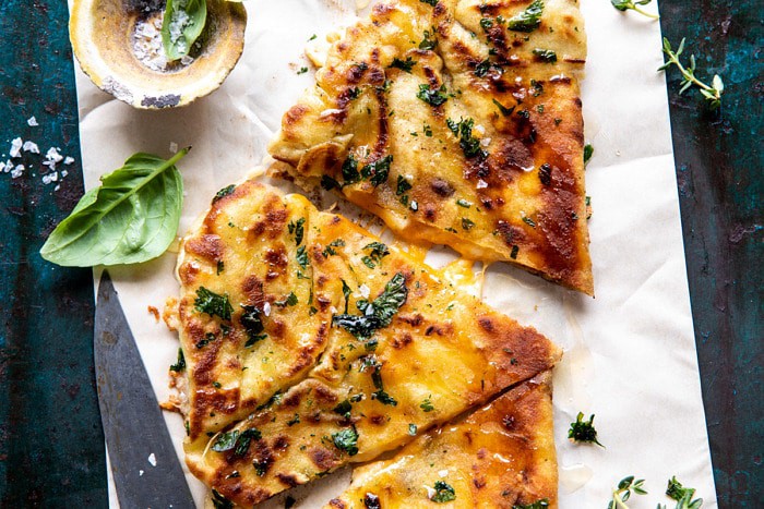 horizontal photo of Garlic Naan Grilled Cheese | halfbakedharvest.com #naan #grilledcheese #easyrecipes 