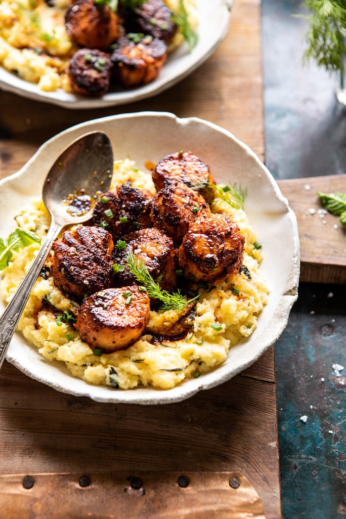 side angled photo of Honey Butter Blackened Scallops with Herby Polenta 