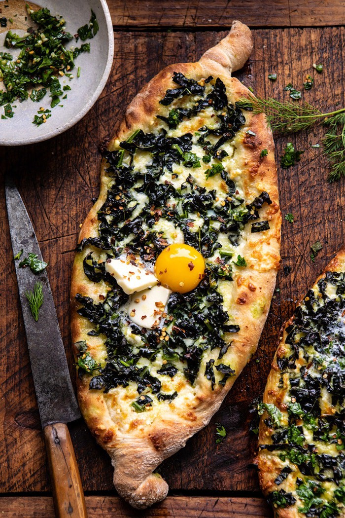 Khachapuri (Georgian Cheese Bread) with Kale and Herb Sauce | halfbakedharvest.com #pizza #easyrecipes #cheese #bread