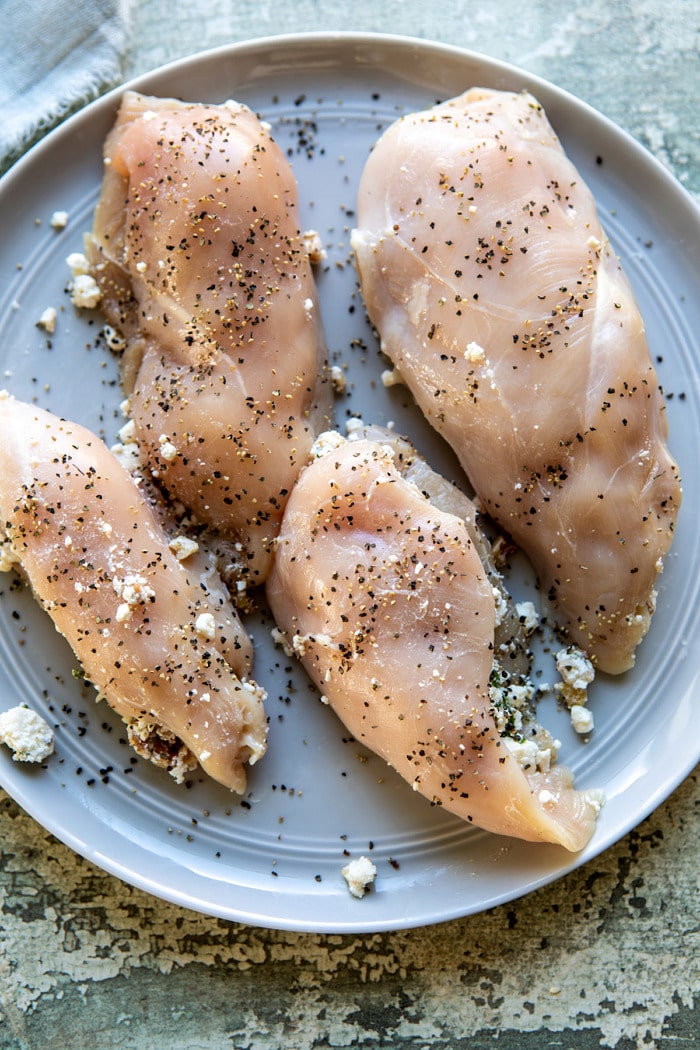 raw chicken before cooking on plate