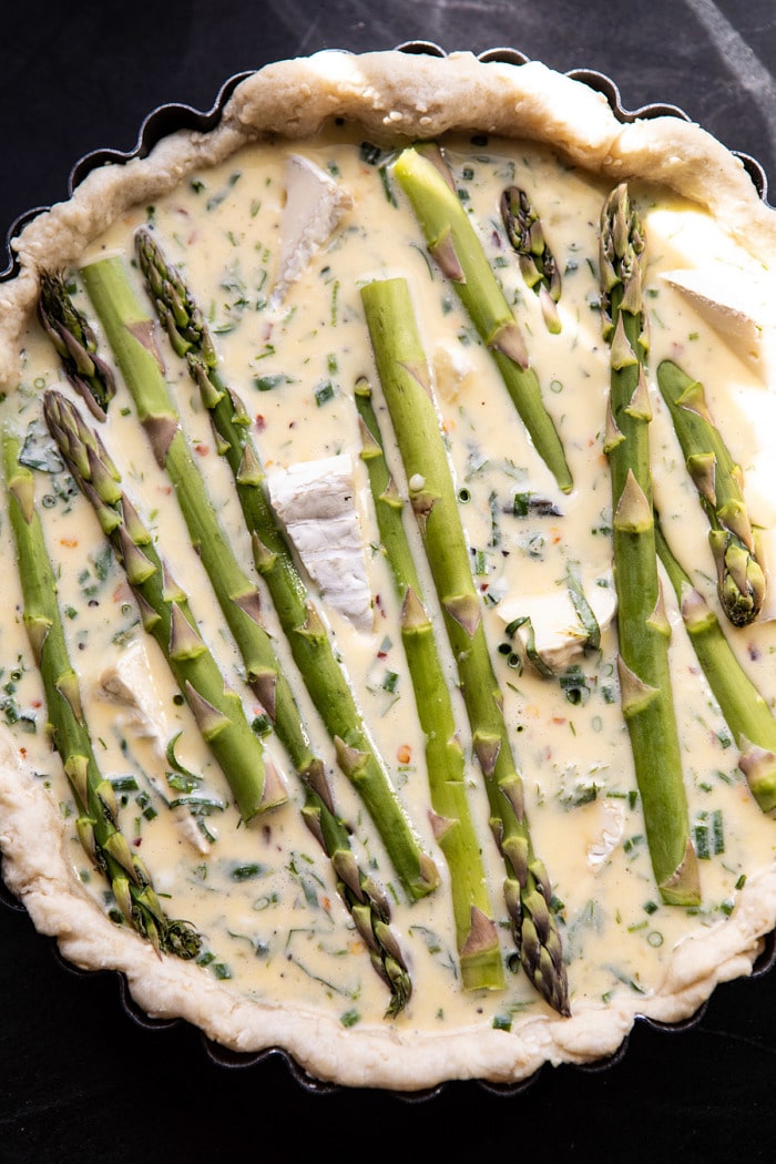 overhead photo of Asparagus and Brie Quiche before baking