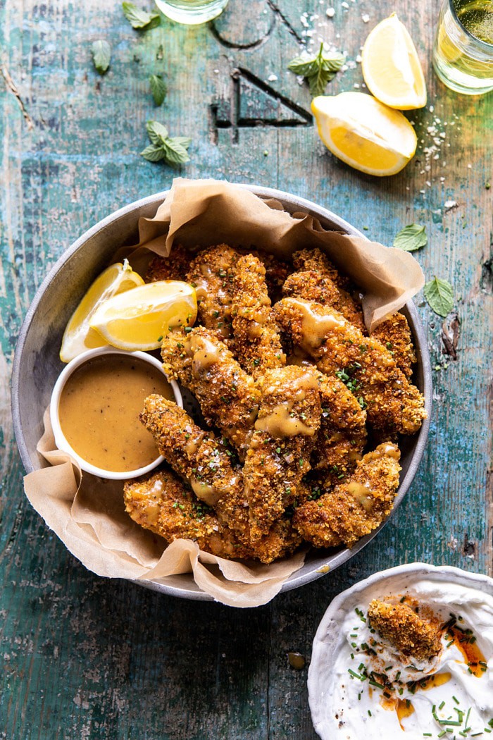 overhead photo of Baked Black Pepper Ranch Chicken Fingers with Honey Mustard in serving bowl
