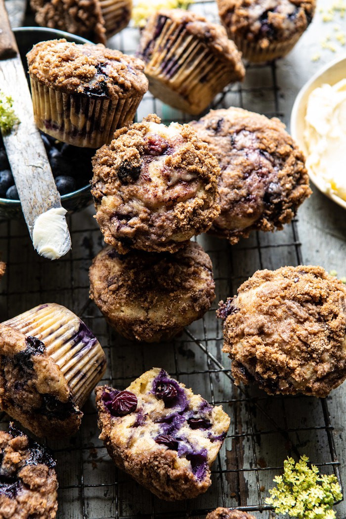 overhead photo of Blueberry Swirl Coffee Cake Muffins with bowl of blueberries in photo 