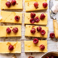Creamy Lemon Bars with Browned Butter Raspberries.