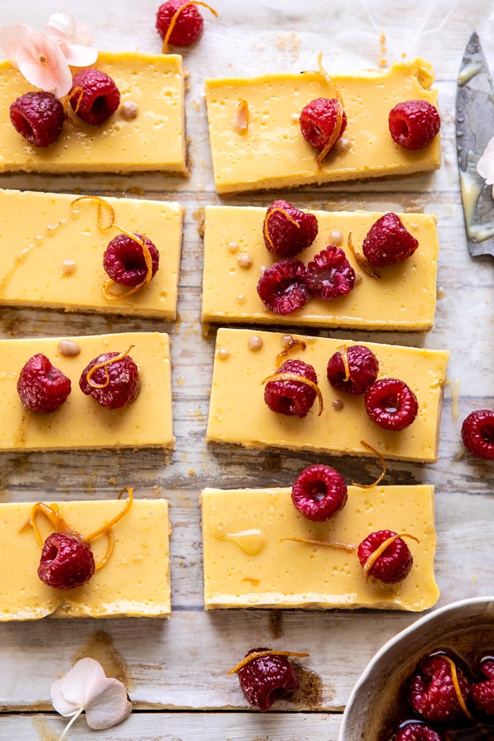 close up overhead photo of Creamy Lemon Bars with Browned Butter Raspberries 
