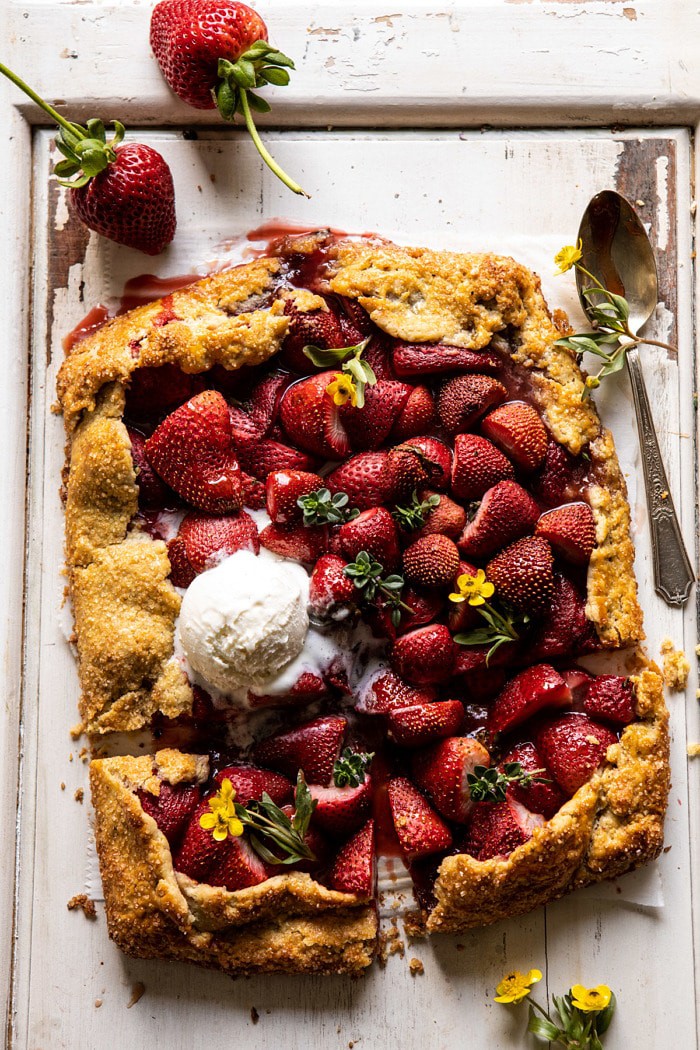 overhead photo of Jammy Strawberry Galette with ice cream and 2 pieces cut