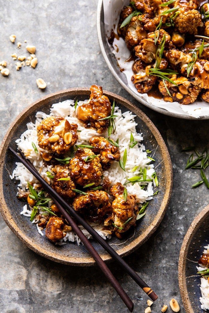 overhead close up photo of Better Than Takeout Kung Pao Cauliflower in bowl with chopsticks 