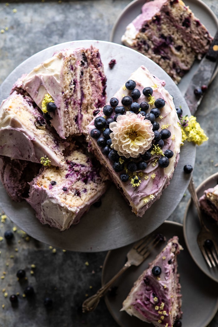overhead photo of Bursting Blueberry Lemon Layer Cake with slices cut