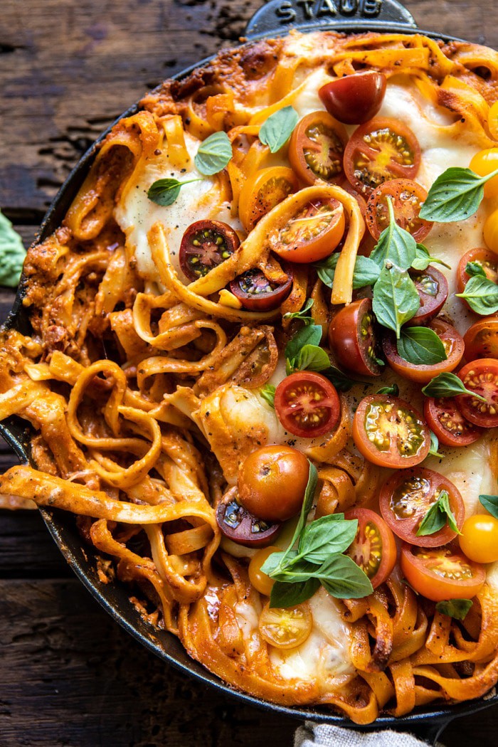 overhead close up photo of One Pot 30 Minute Creamy Tomato Basil Pasta Bake with serving of pasta removed