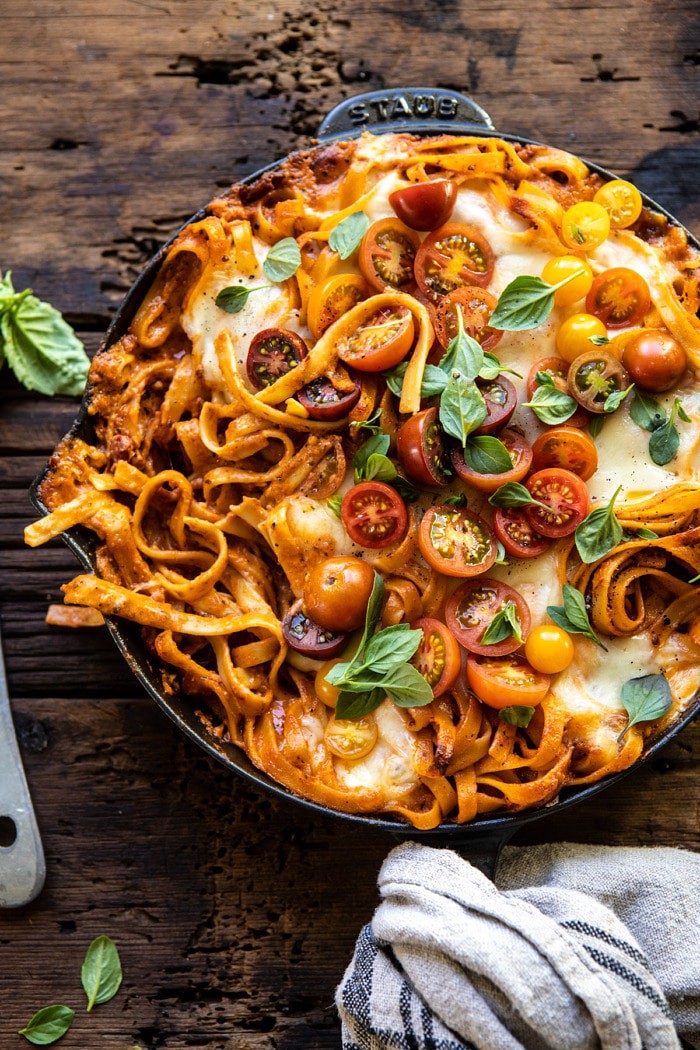 One Pot 30 Minute Creamy Tomato Basil Pasta Bake with serving of pasta removed from skillet 