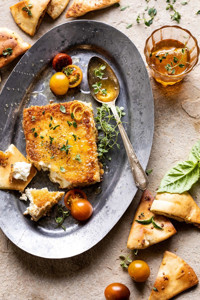 overhead photo of Pan-Fried Feta broken into pieces with Peppered Honey 