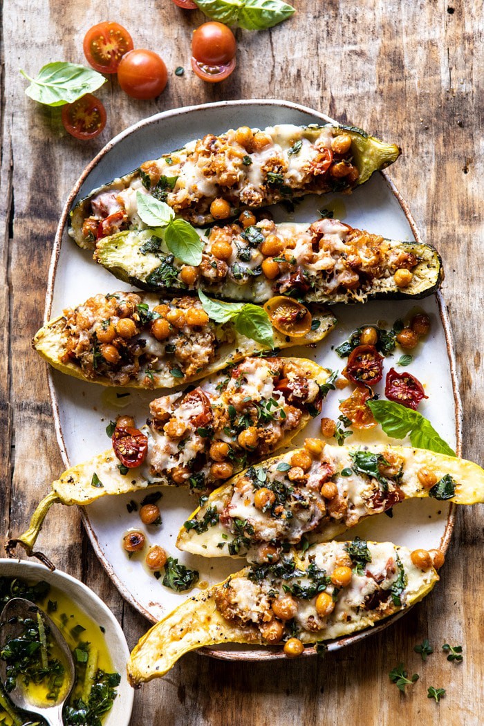 overhead photo of Spicy Chickpea and Cheese Stuffed Zucchini on platter 