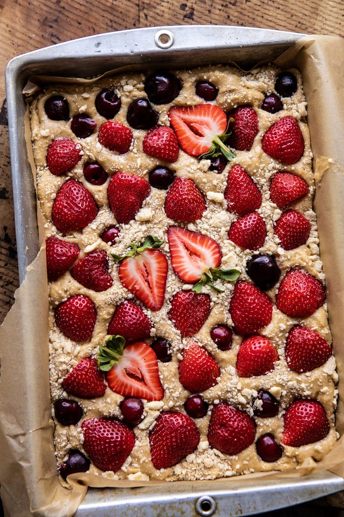 overhead photo of Cherry Strawberry Streusel Cake in baking pan before baking 