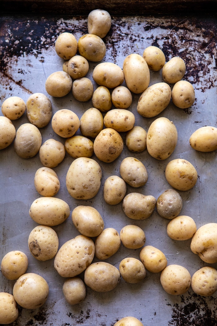 potatoes on baking sheet after cooking in the instant pot