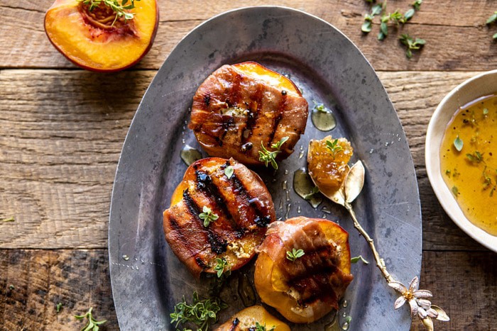 overhead horizontal photo of Prosciutto Goat Cheese Stuffed Peaches with Thyme Honey 