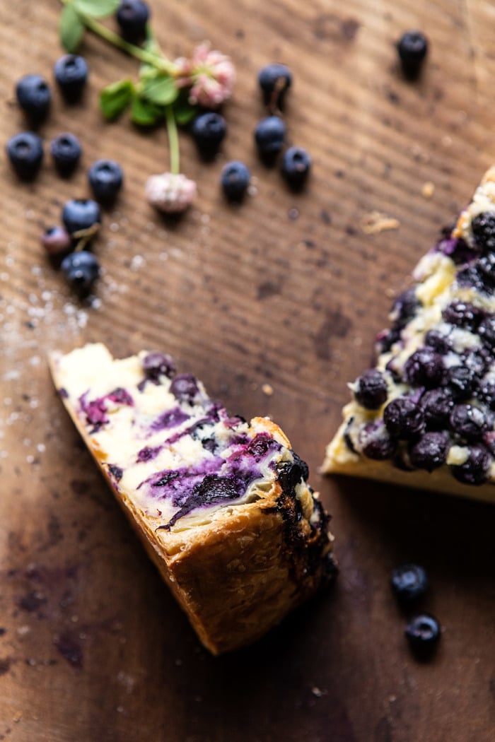 close up photo of Simple Blueberry Basque Cheesecake slice to show the puff pastry crust