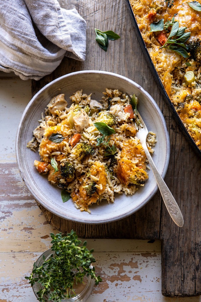 overhead photo of Broccoli Cheddar Chicken and Rice Casserole in single serving dish with fork in dish