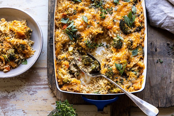 overhead horizontal photo of Broccoli Cheddar Chicken and Rice Casserole with spoon in casserole dish