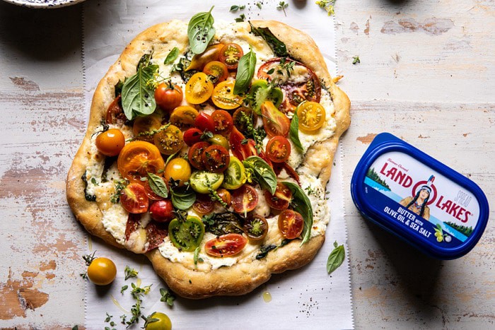 horizontal photo of Herbed Butter Heirloom Tomato Pizza 