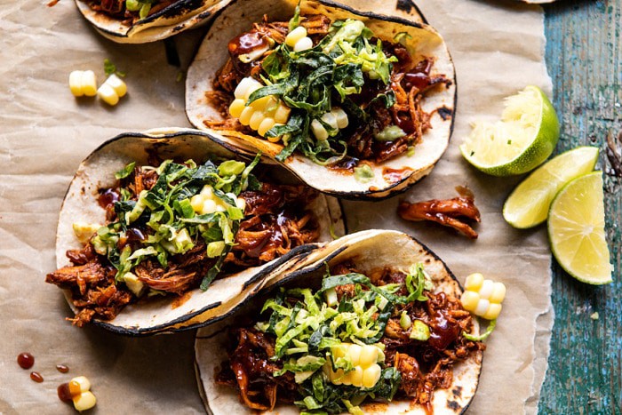 overhead horizontal photo of Instant Pot BBQ Beer Pulled Chicken Tacos with Ranch Corn Slaw 
