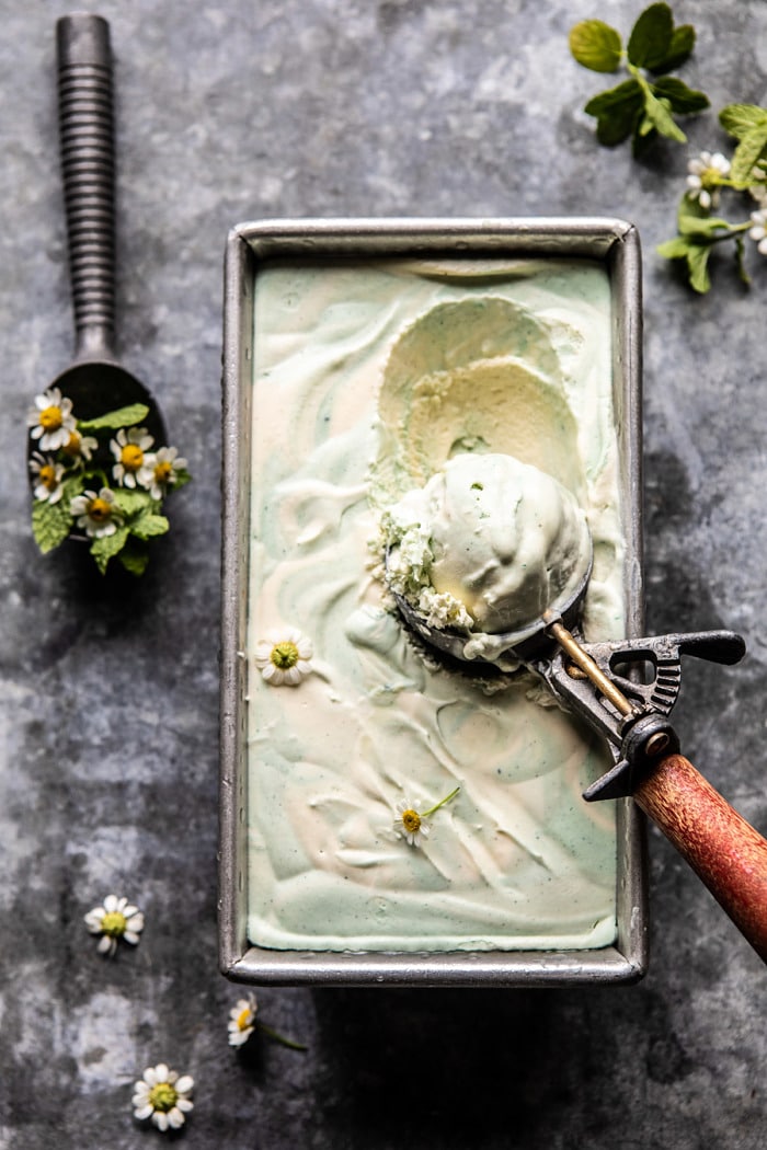 overhead photo of No Churn Minted White Chocolate Swirled Ice Cream with ic cream scoop in ice cream
