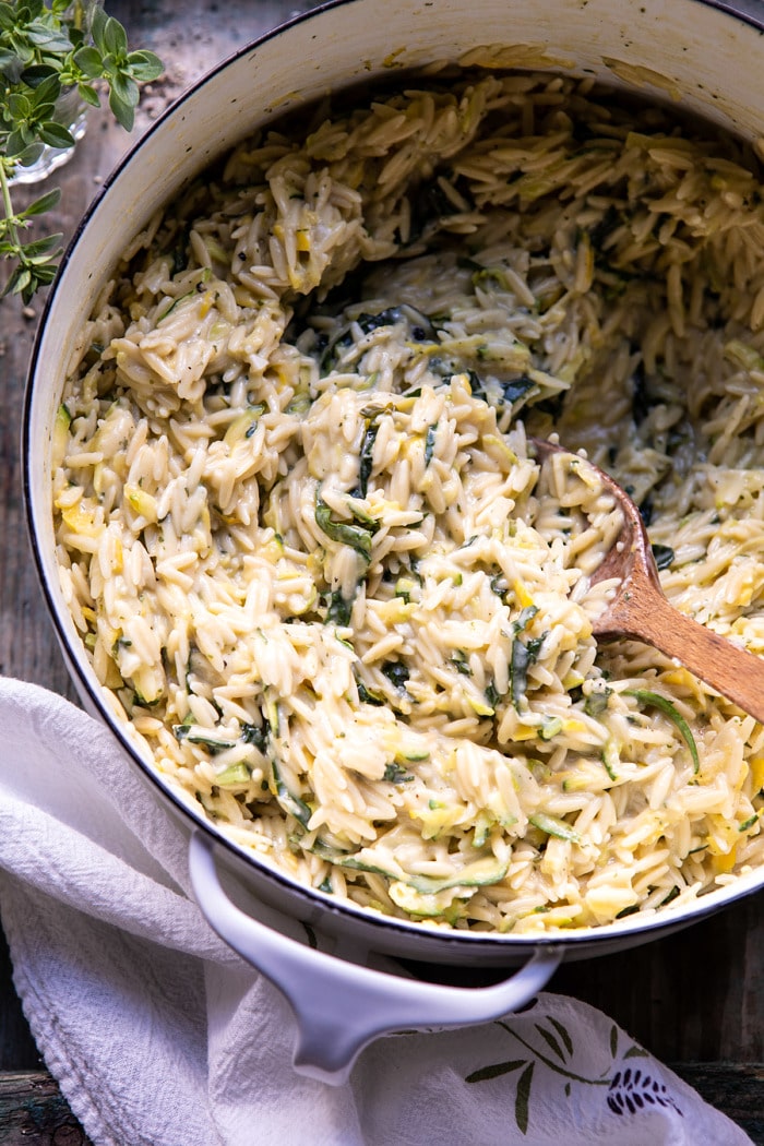 overhead close up photo of Souper Creamy Lemon Butter Cheesy Zucchini Orzo in cooking pot
