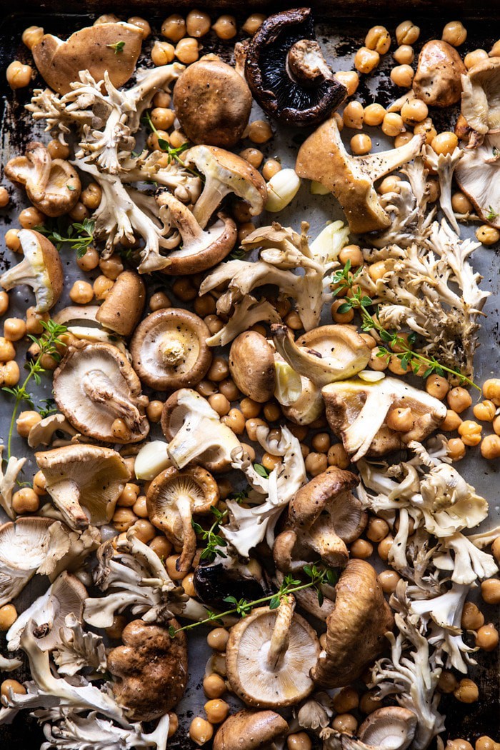 overhead photo of Mushrooms and Chickpea on baking sheet before roasting