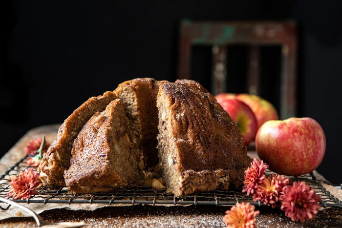 horizontal photo of Spiced Pecan Apple Cider Doughnut Cake with pieces cut