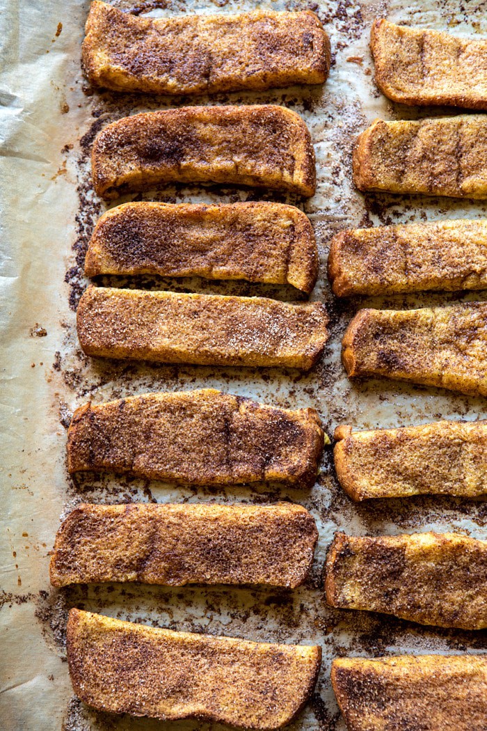 overhead photo of Cinnamon Sugar French Toast Sticks after baking on baking sheet
