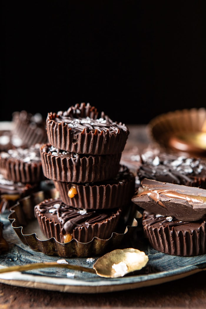 side angled photo photo of 6 Ingredient Milk Chocolate Salted Caramel Cups stacked on top of each other 