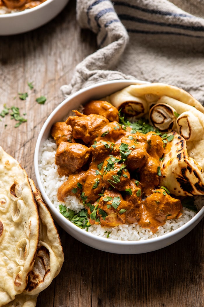 side angled photo of Super Simple Coconut Chicken Tikka Masala in bowl with rice