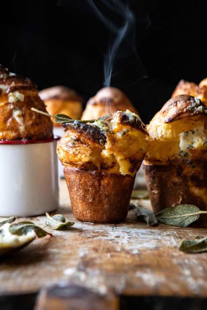 Parmesan Popovers with Crispy Sage Garlic Butter with steam coming out