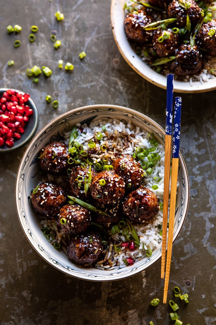 overhead photo of Weeknight Sticky Ginger Sesame Chicken Meatballs with chopsticks on bowl 