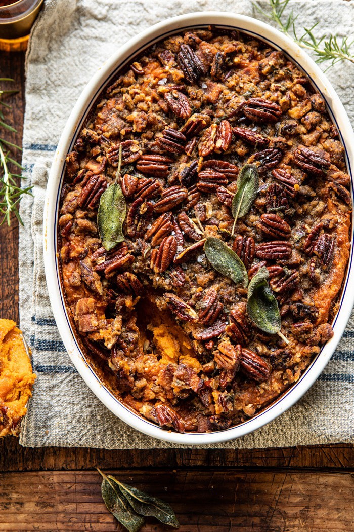 overhead photo of Bourbon Sweet Potato Casserole with Sweet n Savory Bacon Pecans with spoonful removed from casserole 