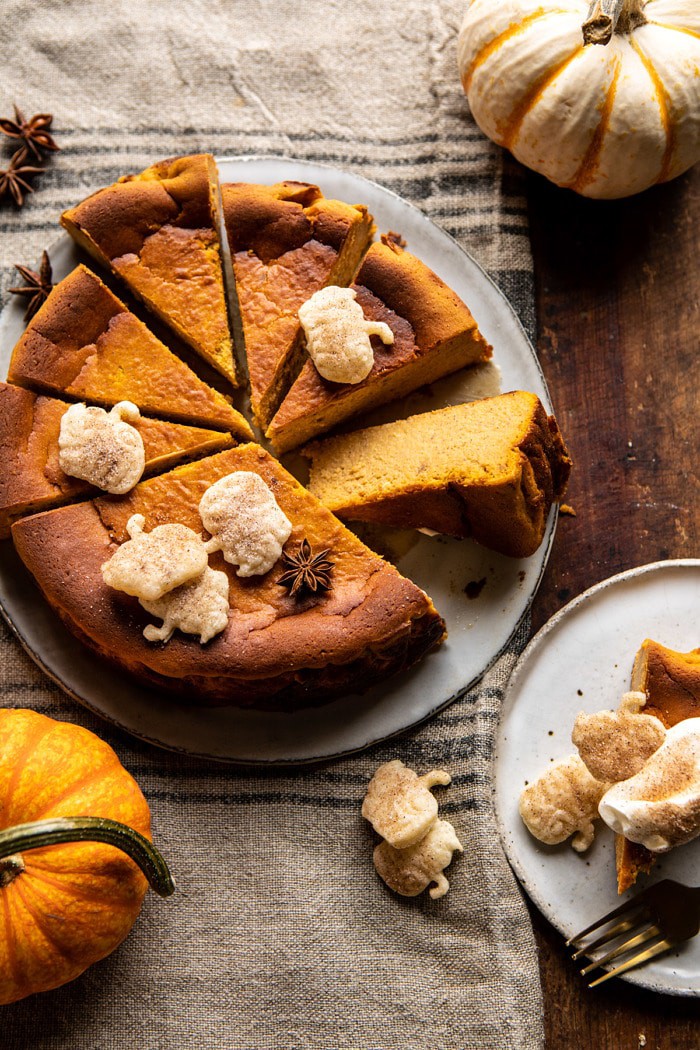 overhead photo of Burnt Basque Pumpkin Spice Cheesecake with multiple slices cut and 1 slice turned outward to show the center of cake