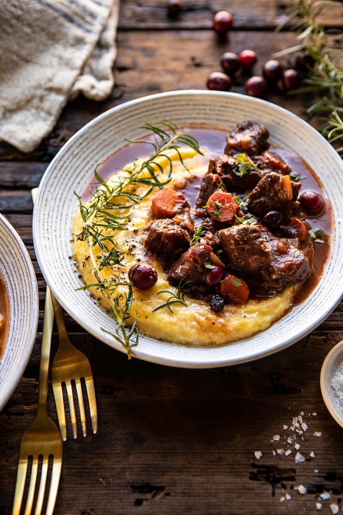 side angled photo of Cranberry Cider Braised Beef Stew with Rosemary Polenta