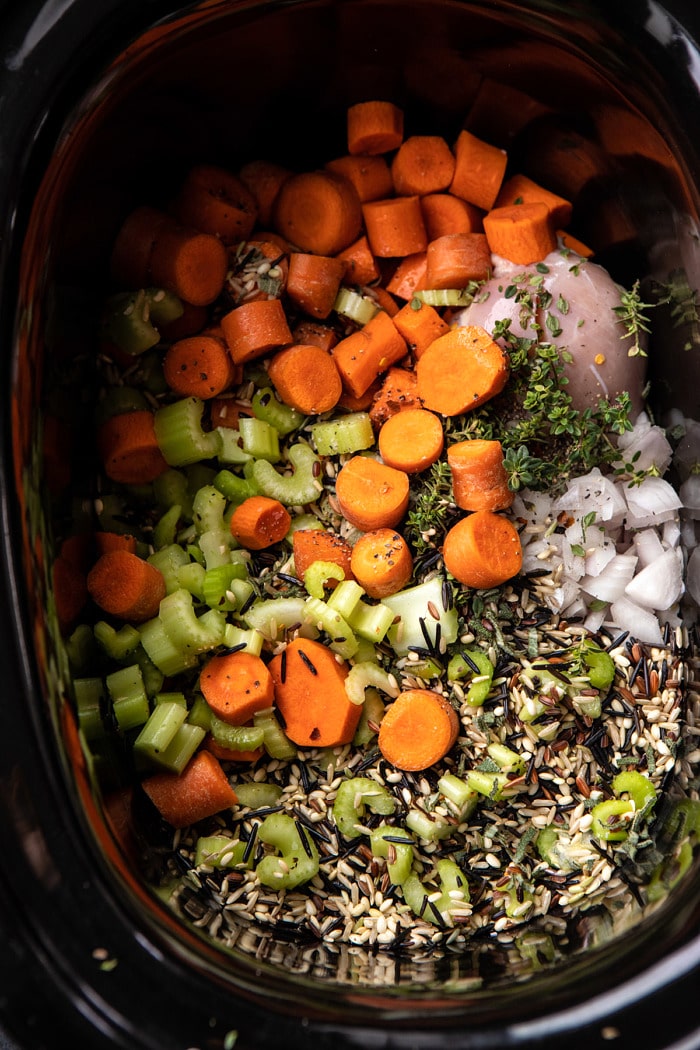 overhead photo of soup ingredients in slow cooker before cooking 