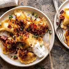 Cheddar Pierogies with Caramelized Onions and Bacon.