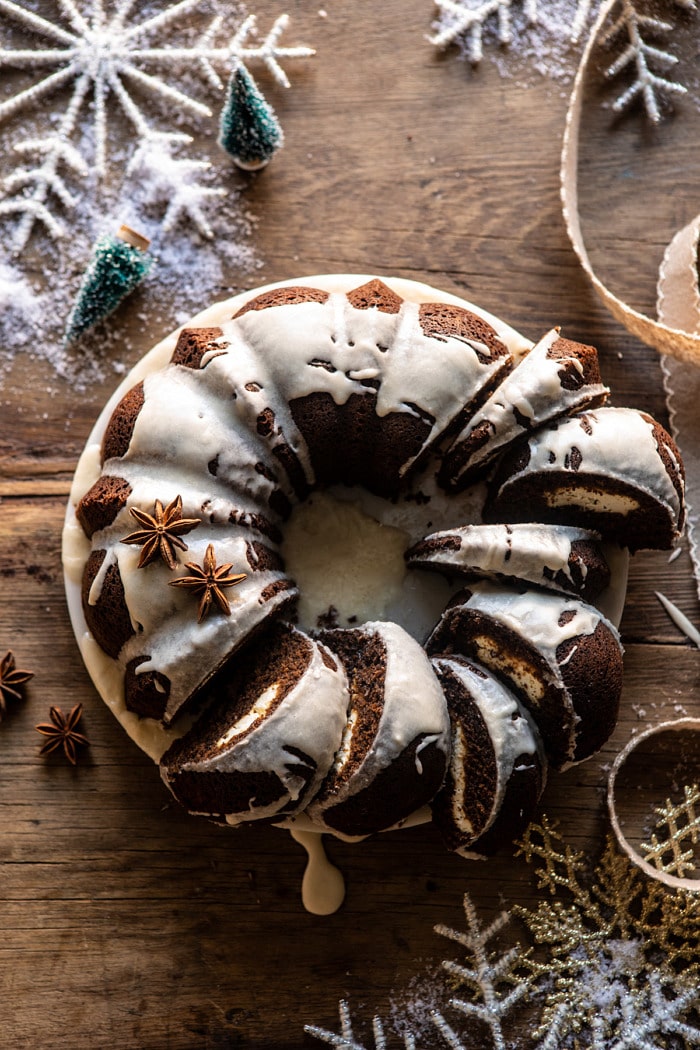 overhead photo of Cream Cheese Swirled Chai Gingerbread Cake with multiple slices of cake cut