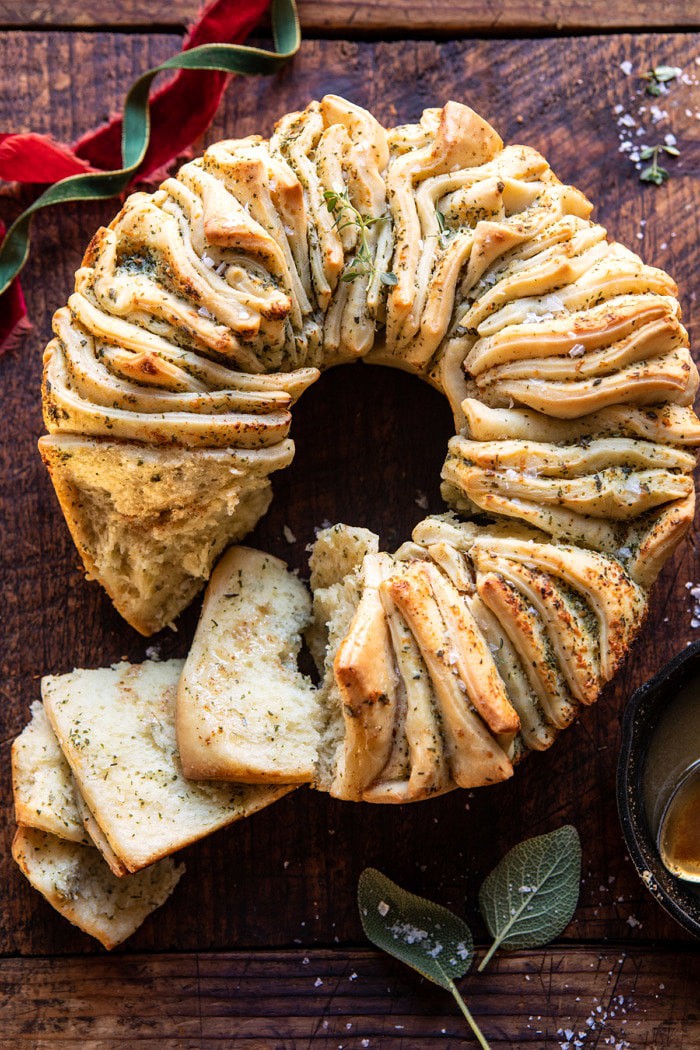 overhead photo of Pull-Apart Garlic Butter Bread Wreath with a few slices pulled off of bread