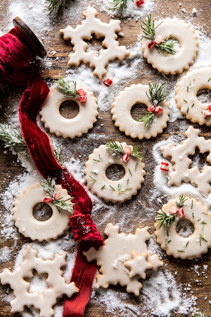 overhead photo of Vanilla Wreath Cookies with ribbon running through the cookies