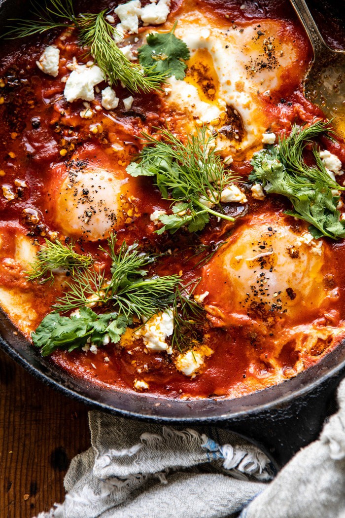overhead close up photo of Eggs in Purgatory with Chile Butter and Feta 