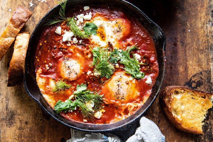 overhead horizontal photo of Eggs in Purgatory with Chile Butter and Feta